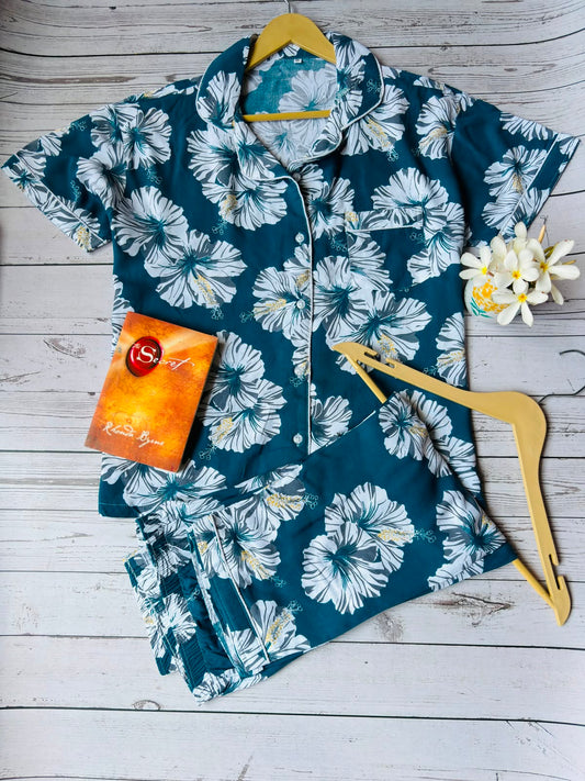 Floral patterned shirt on a wooden hanger with a wooden background