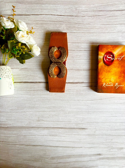Brown leather belt with gold circular buckle